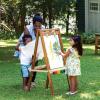 imageGuidecraft Acadia IndoorOutdoor Art Easel for Kids Acacia Wood DoubleSided Foldable SeeThru Easel  Easy to Clean Art Station w 5 Paint Cups Paper Clips Clear DryErase Board Marker Tray
